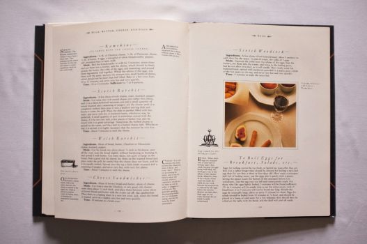 On these two pages from Chapter 12 of The Shorter Mrs. Beeton, on Milk, Butter, Cheese and Eggs, are six recipes for basics such as Welsh Rarebit, Cheese Sandwiches and even To Boil Eggs, along with a colour photograph of Cayenne Cheeses and Cheese Ramekins.